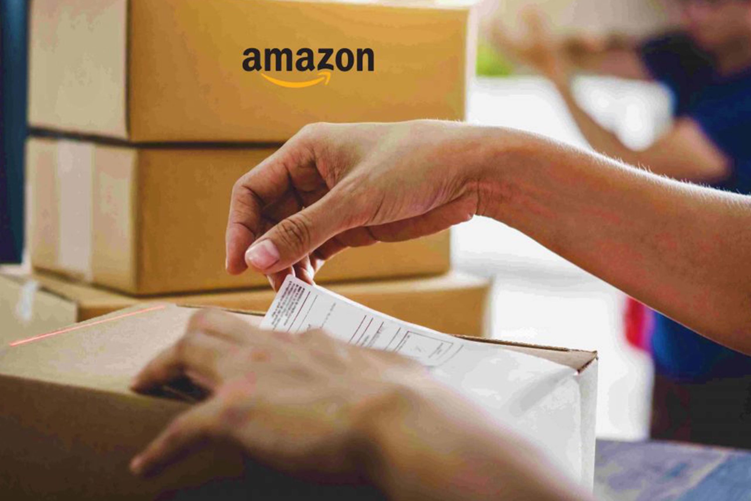 A Person's hand checking the Amazon Delivery Form